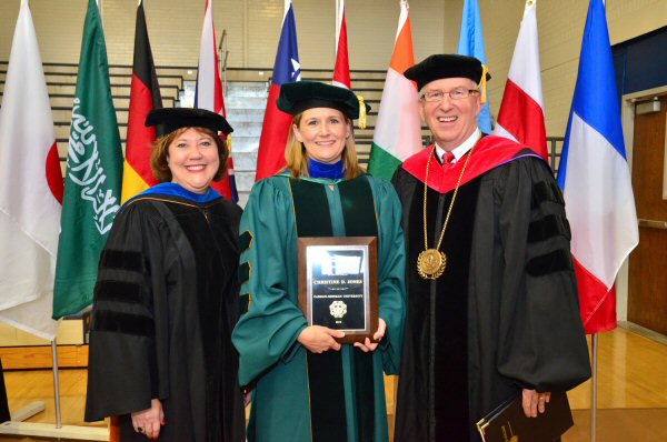 Dr. Christine Jones, center, is congratulated by Dr. Kina Mallard, Carson-Newman’ s executive vice president and provost, and C-N President Randall O’Brien following the University’s Fall Convocation.  Jones was this year’s recipient of the Teaching Excellence and Leadership Award.