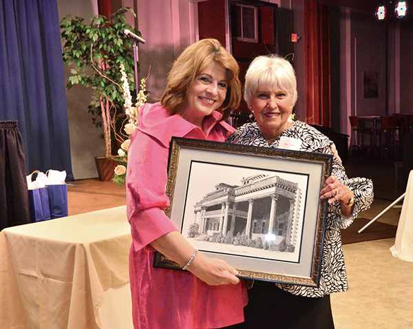 Kay O’Brien (left) who serves as president of Carson-Newman University’s Women of Vision, presents Betty Catlett with the organization’s Distinguished Service Award.  The presentation came during a donor recognition dinner held on campus.