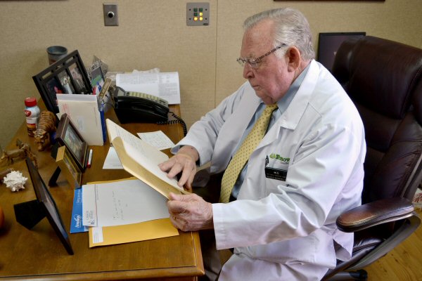 Dr. David McConnell, a Newport physician and 1961 alumnus, reviews his undergraduate lab notebook.  He is one of scores of Carson-Newman graduates who have had the opportunity to receive their research notes.