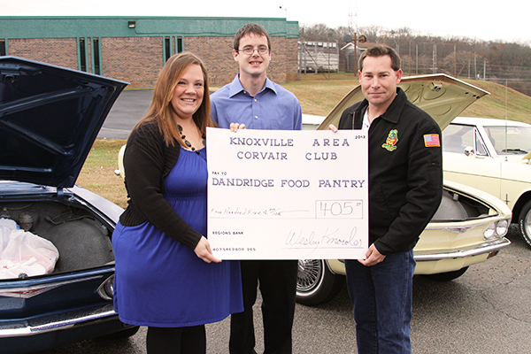 Dandridge Ministerial Association Director Beth Cash and Kyle Cash receive donation from Knoxville Corvair Club President Richard Payne, Saurday, December 15, 2013- Jefferson County Post Staff Photo by Jeff Depew