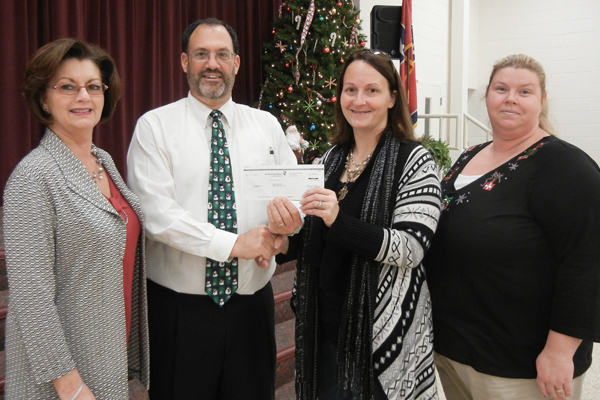 Vickie Forgety (Principal), Richard Hall (MWA Representative), Tracey Bommarito (PTO President) and Stephanie Bales (PTO Treasurer)