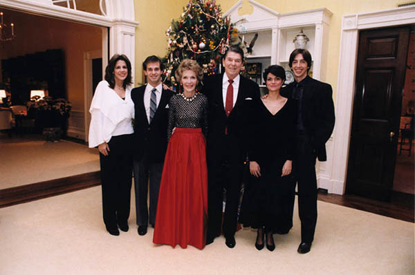 The 1983 Reagan Family Christmas portrait by the White House residence Christmas tree: (from left to right) Patti Davis, Paul Grilley, Nancy Reagan, President Reagan, Doria Reagan, Ron Reagan.