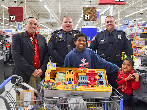 L/R - Walmart store manager Joe Gibson, Officer Shane Hanshew, Officer Andy Dossett, along with Derrick and Brad.Jefferson County Post Staff Photo by Sara May