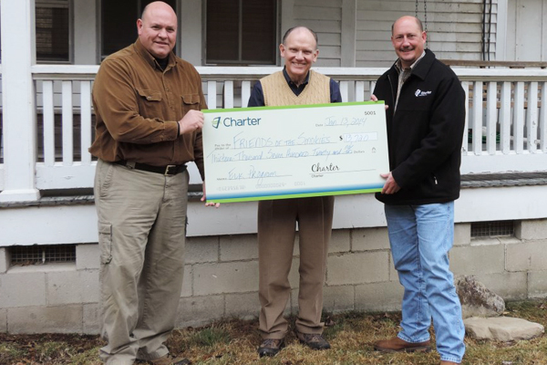 Jim Hart, Friends of the Smokies, receives check from Charter Representatives Mark Spilman (left) and Kenny Parker(right)