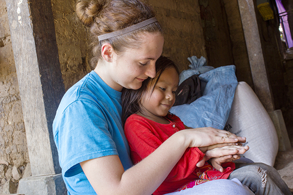 Carson-Newman University student Bevan Brown, left, plays with a new friend during last year's SPOTS mission trip to Guatemala.  Since clean water is a challenge in remote areas of the country, several C-N students will be returning during spring break to deliver additional water filters to those in need.