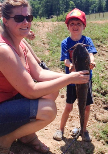 Hezekiah age 7 and his first fish.  The fish is almost as long as he is tall.Submitted by TWRA Officer Wayne Rich