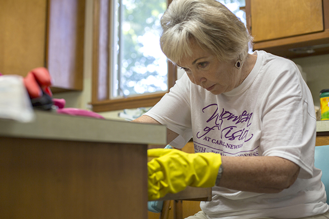 Linda Sellers a 1969 alumna and Jefferson City resident helps prep for renovations at Carson-Newman University’s Appalachian Center. Sellers was one of 15 volunteers representing the University’s Women of Vision organization who helped with work at the Center earlier this month.
