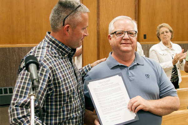 Commissioner Turner presenting honorary resolution to past County Clerk Rick FarrarStaff Photo by Jeff Depew