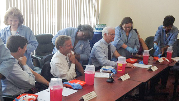 TDH Commissioner John Dreyzehner; Gov. Bill Haslam; Shelby County Mayor Mark Luttrell and Shelby County Health Department Director Yvonne Madlock receive their annual seasonal flu vaccinations in Memphis.