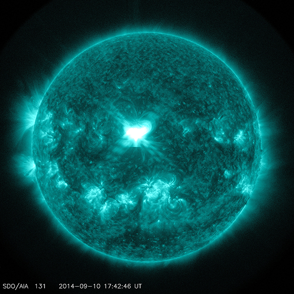 An X1.6 class solar flare flashes in the middle of the sun on Sept. 10, 2014. This image was captured by NASA's Solar Dynamics Observatory and shows light in the 131 Angstrom wavelength, which is typically colorized in teal. Photo by NASA/SDO