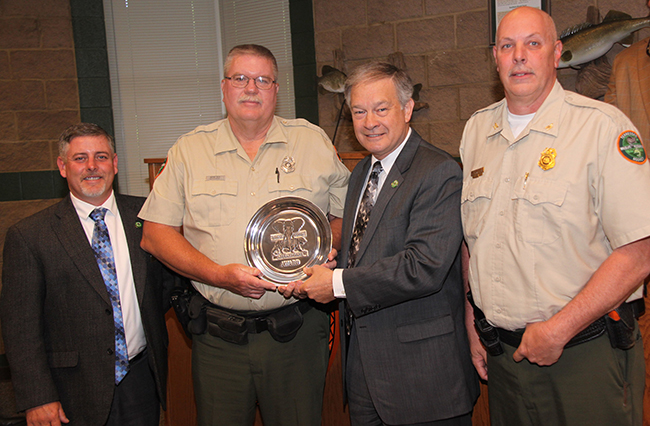 Wayne Rich (second from left) is the Tennessee recipient of the 2014 Shikar-Safari Club International TWRA Officer of the Year. He was presented the award at the May meeting of the Tennessee Fish and Wildlife Commission. Also pictured (from left) are TFWC Chairman Jim Bledsoe, TWRA Executive Director Ed Carter, and TWRA Boating and Law Enforcement Division Chief Darren Rider.