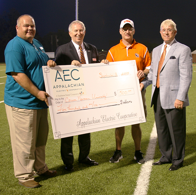 From left to right: AEC Member Services Director Mitch Cain, CNU President Randall O’Brien, AEC General Manager Greg Williams, and CNU Athletic Director Allen Morgan gathered at the halftime of the football team’s season opener to present and accept a donation that will help the University make good use of some under-utilized parcels of land.