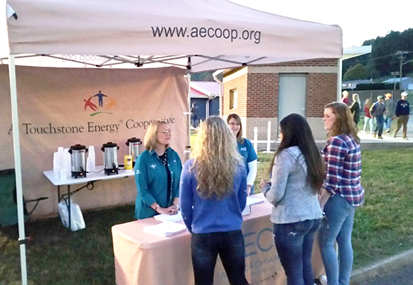 AEC employees Kim McGhee and LaDuska O’Quinn dispensed energy efficiency advice and hot apple cider to folks stopping by on their way to support the Jefferson County Patriots at last week’s football game.Photo Submitted