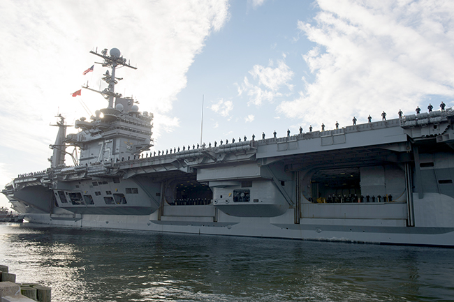 151116-N-KD168-052NORFOLK (Nov. 16, 2015) The aircraft carrier USS Harry S. Truman (CVN 75) departs Naval Station Norfolk. The Harry S. Truman Carrier Strike Group is deploying in support of maritime security operations and theater security cooperation efforts. With Harry S. Truman as the flagship, strike group assets include the embarked squadrons of Carrier Air Wing (CVW) 7, Destroyer Squadron (DESRON) 28 and ships USS Anzio (CG 68), USS Bulkeley (DDG 84), USS Gravely (DDG 107), and USS Gonzalez (DDG 66). (U.S. Navy photo by Mass Communication Specialist 3rd Class Magen Reed/Released)