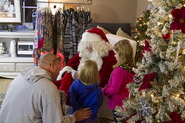 Santa himself greets and has photos made with children at Cosmo Boutique in Historic Downtown DandridgeStaff Photo by Jeff Depew