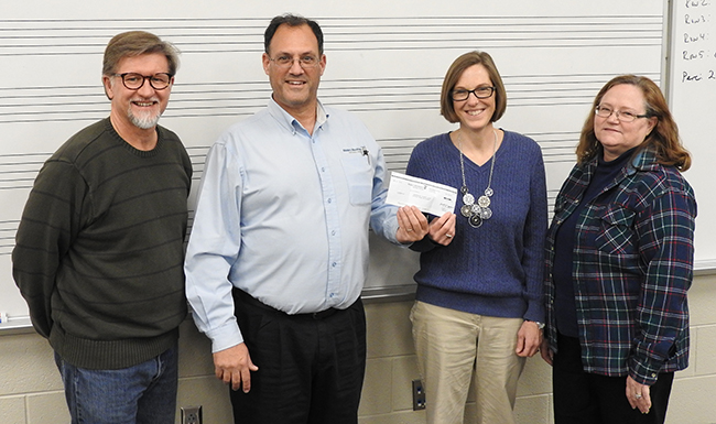 L/R: Greg Jones, band director; Richard Hall, MWA representative; Susan Garber and Evelyn Griffin, booster board members.