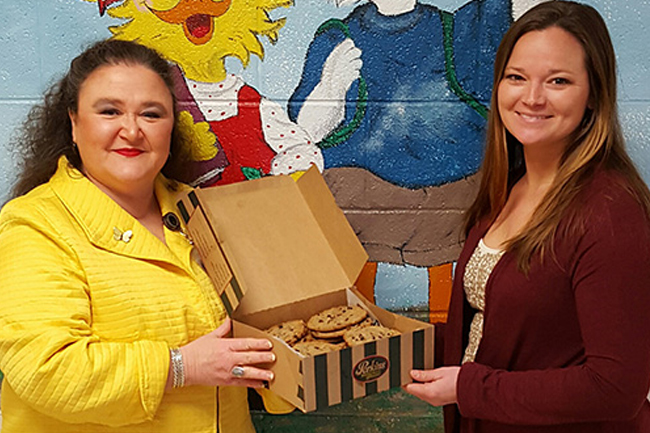 Becky Burks (left), AEC Communications Coordinator shares sweet treats with Dandridge Elementary 5th grade teacher, Katy Bridgewater.Appalachian Electric Cooperative