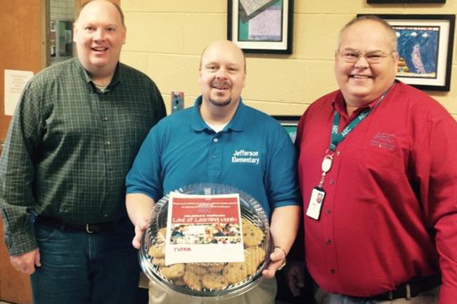 AEC delivered sweet treats to Jefferson Elementary School faculty and staff. Pictured left to right is JES Teacher Mentor / Evaluator, Glen Wolfenbarger; JES Principal, Craig Day and AEC Director of Member Services, Mitch Cain.Appalachian Electric Cooperative