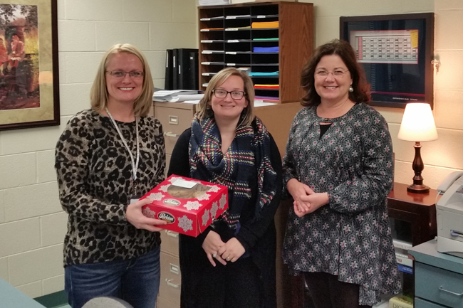 AEC Member Service Representative, Kim McGhee (left) delivers sweet treats to the faculty and staff of Piedmont School.Appalachian Electric Cooperative