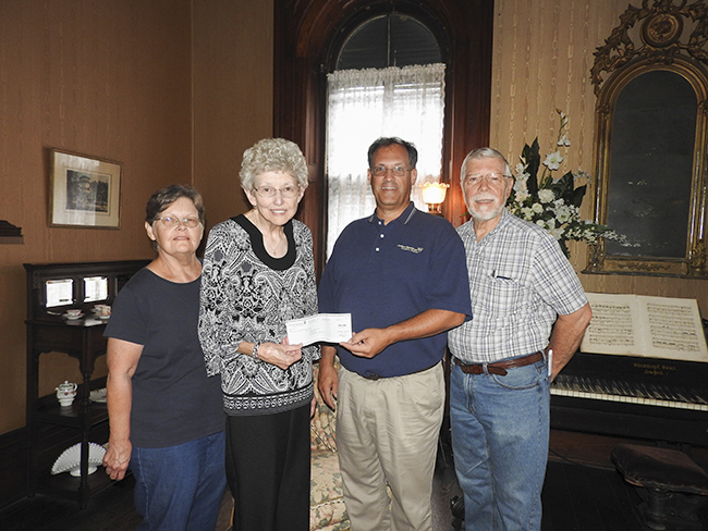 L/R: Connie Harlan (treasurer), JoAnne Vest (president), Richard Hall, Phil Kindred (board member)Submitted by Richard Hall, Modern Woodmen of America