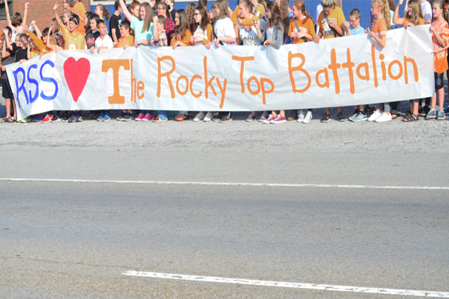 Students at Rush Strong School cheer on ROTC Cadets as they carry game ball to Bristol.Staff Photo by Angie Stanley