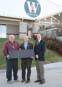 AEC Member Services Director Mitch Cain presents WSCC President Dr. Tony Miksa (center) with a symbolic solar panel as Great Smoky Mountain Expo Center Assistant Director Michael Hasty looks on. The Expo Center will be receiving a monthly electric bill credits for the next 20 years as a result of a gift from the Co-op: the generation output of four panels at AEC’s new Community Solar facility in New Market.