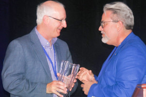 AEC General Manager, Greg Williams, left, took home the Distinguished Service Award from the Tennessee Valley Public Power Association's Annual Conference 