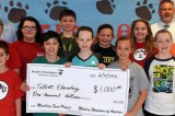 Students from Talbott Elementary School Accept a Check from Modern Woodmen of America